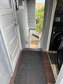 Stairs next to shared laundry