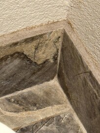 Hair and guck on countertop backsplash