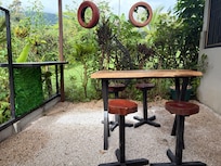 Charming little outdoor seating area outside the kitchen