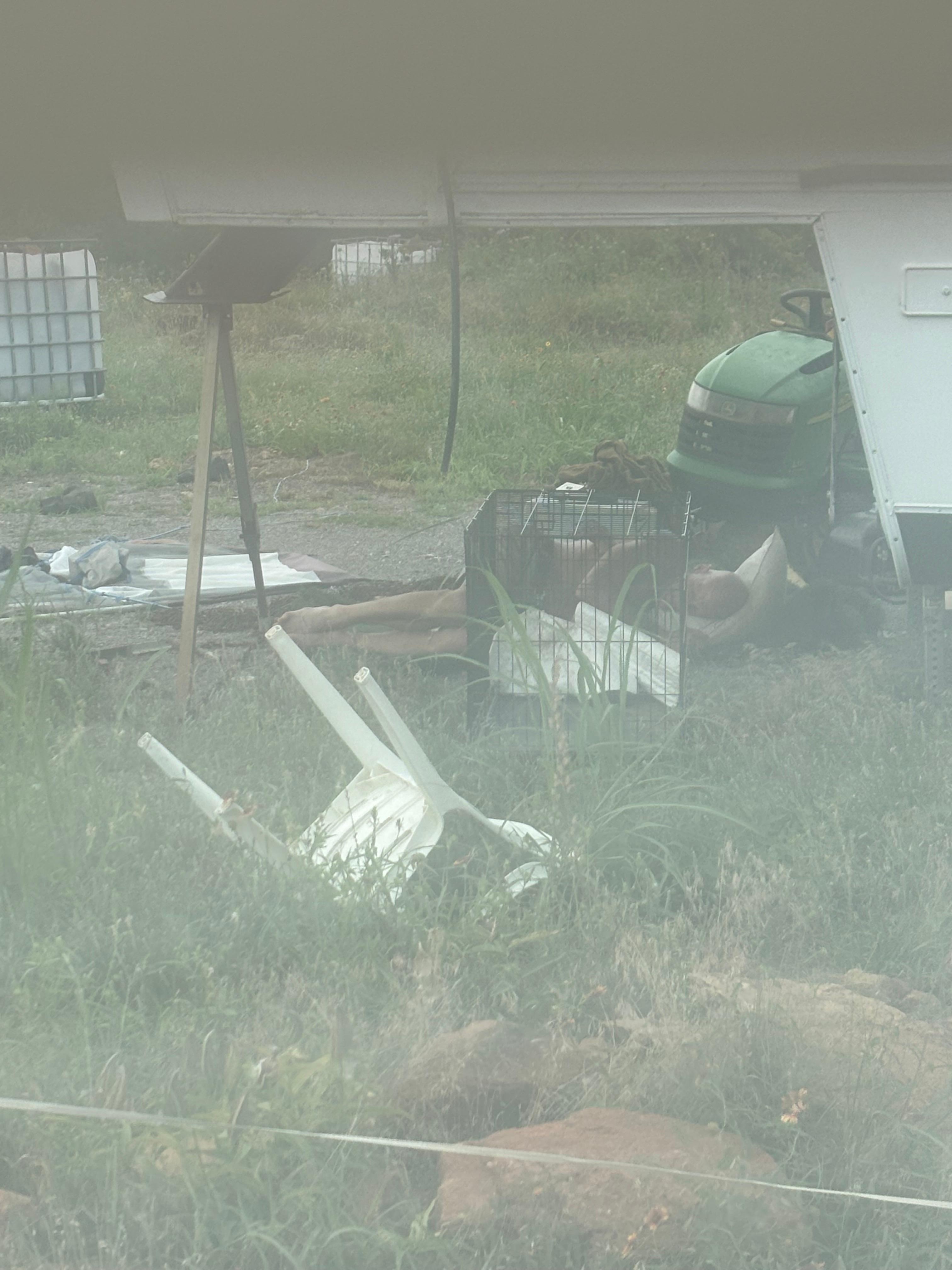 You can see the man asleep amongst the trash. This was right outside the bedroom window.