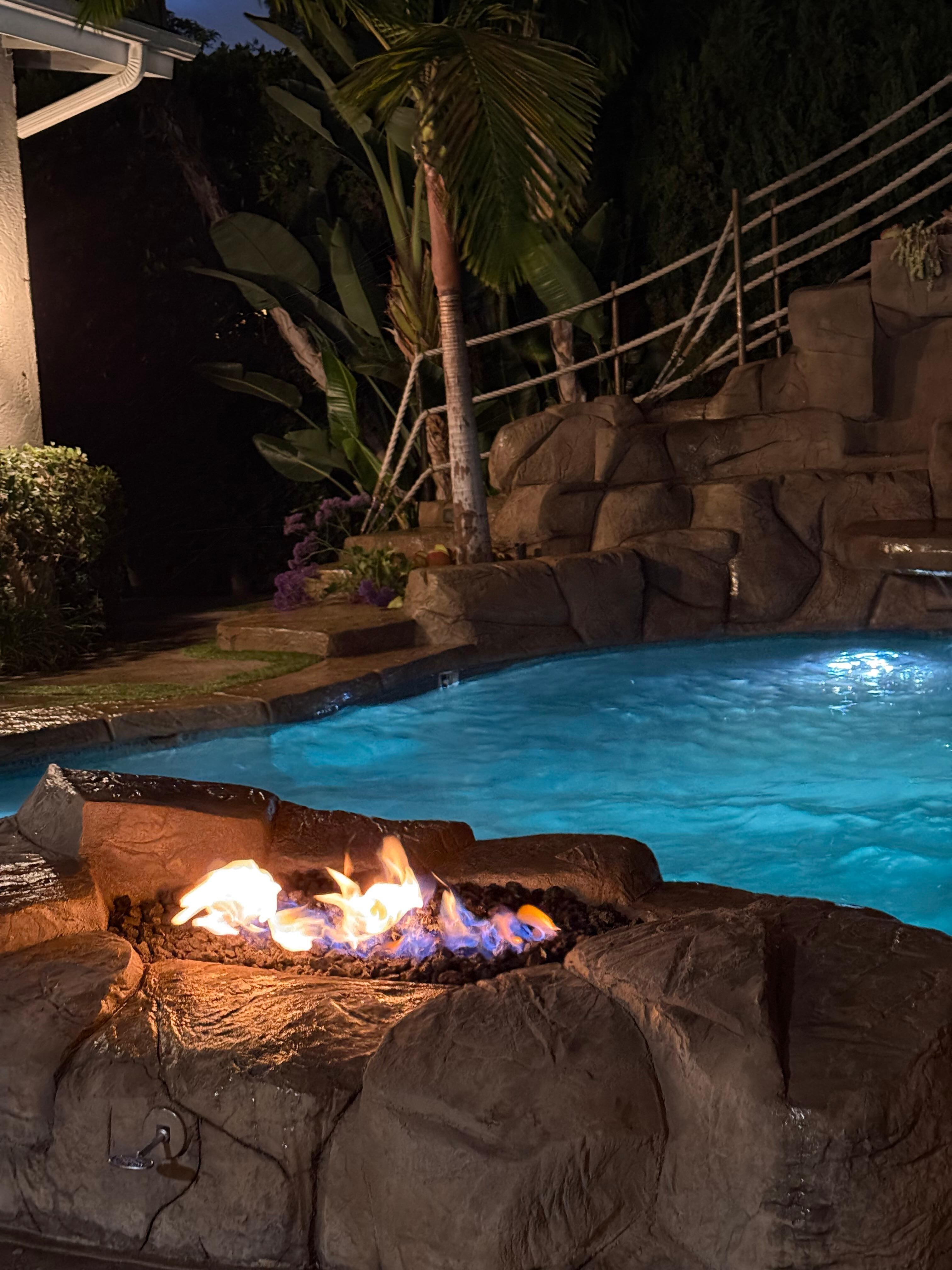 Night swimming w/ fire pit glowing, so nice! 
