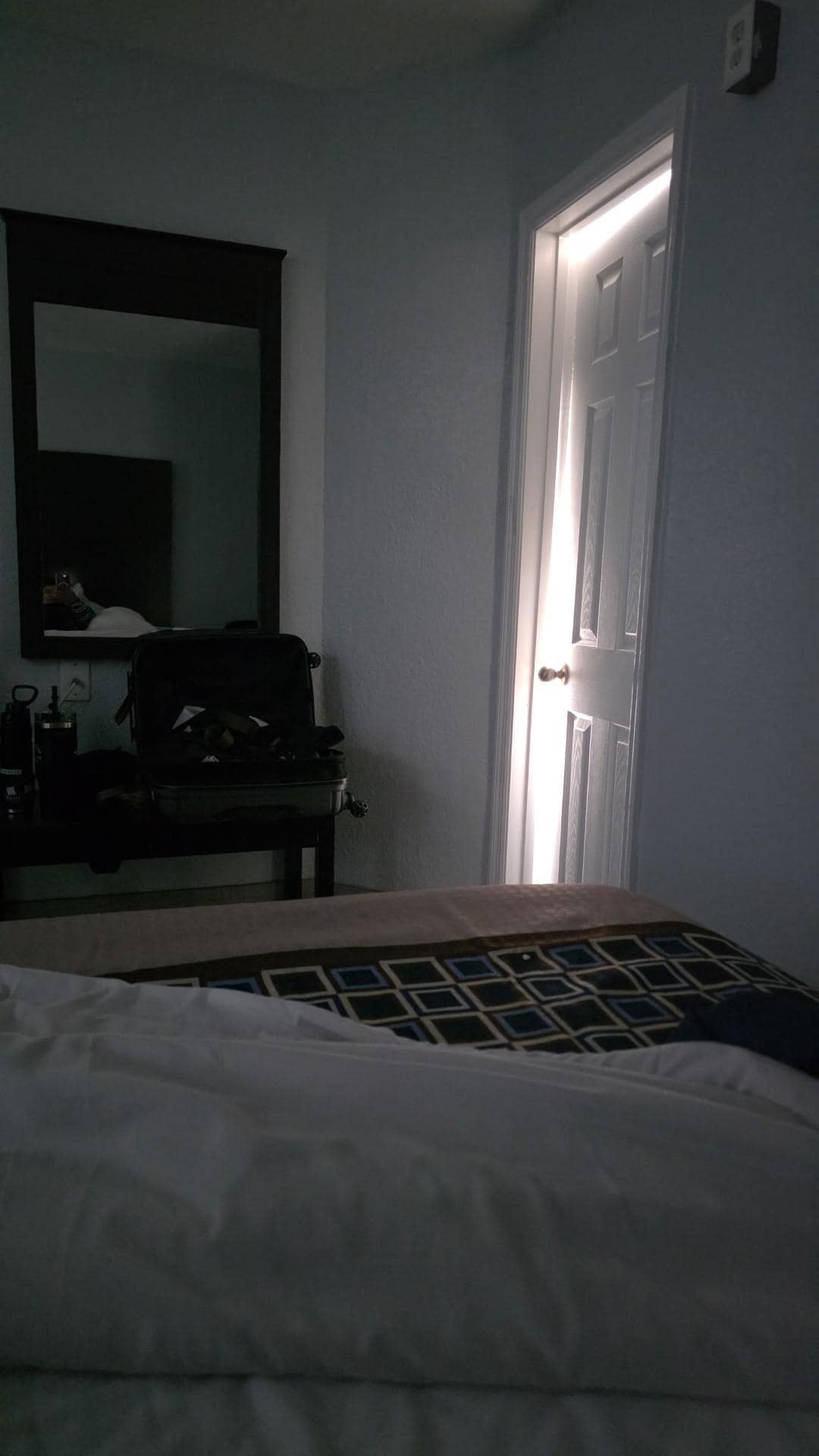 Bathroom door not closing properly.  Shower head leaking water.  No soap in dispenser. Small Bathroom sink. Only one chair in room to sit. 
 