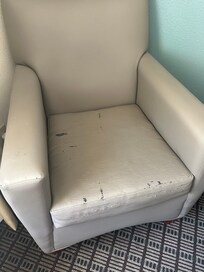 Tattered chair in room