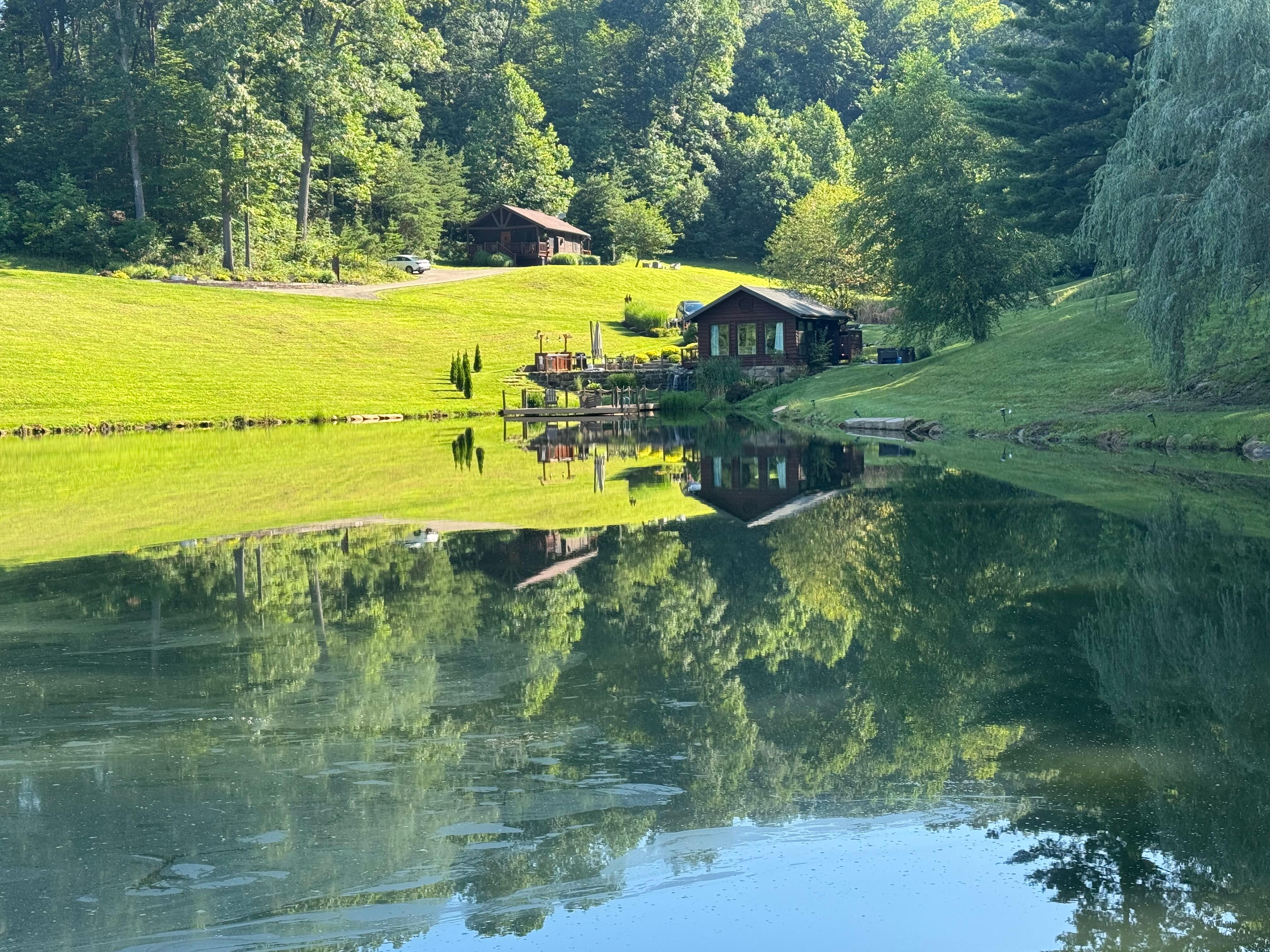 View of the cabin from the other side of the pond.