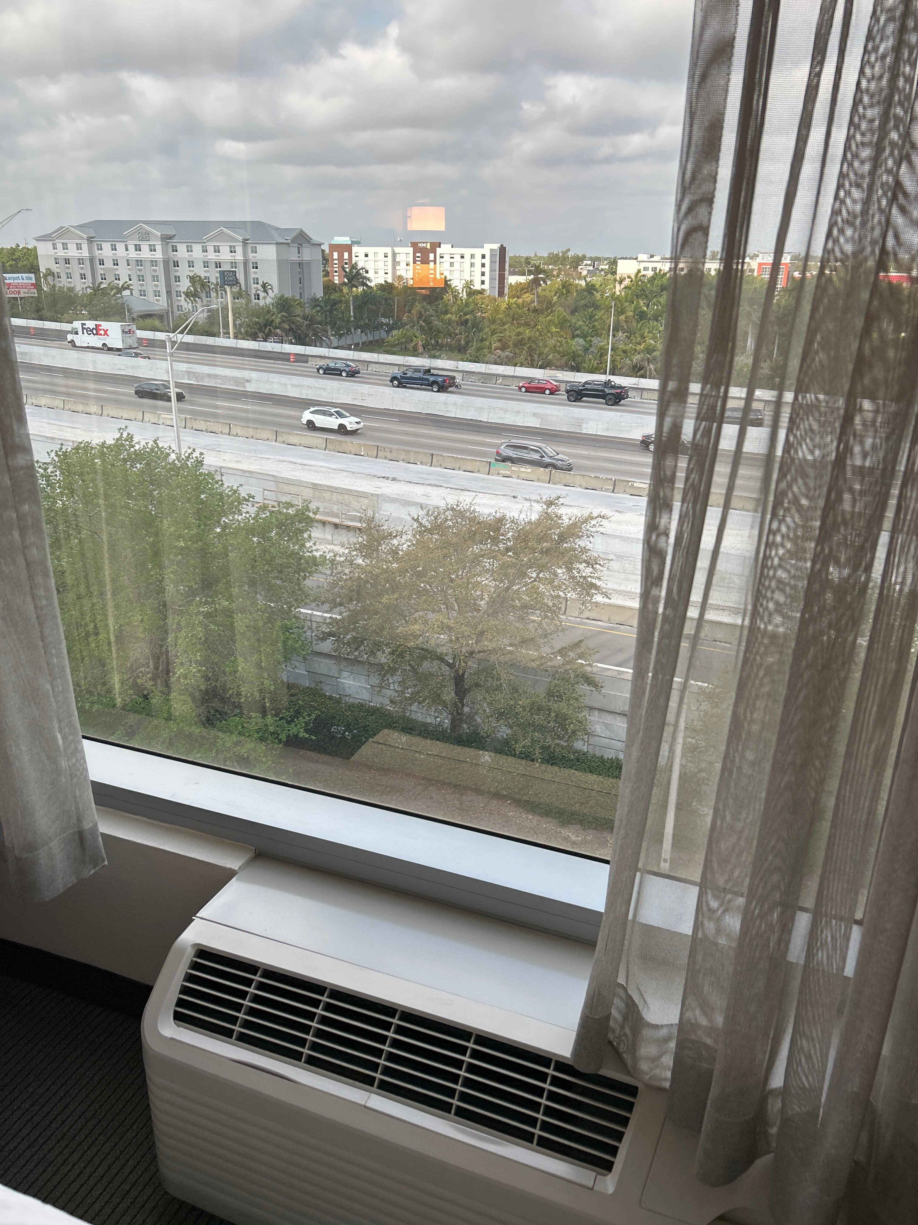 Use air conditioner to drown out highway noise