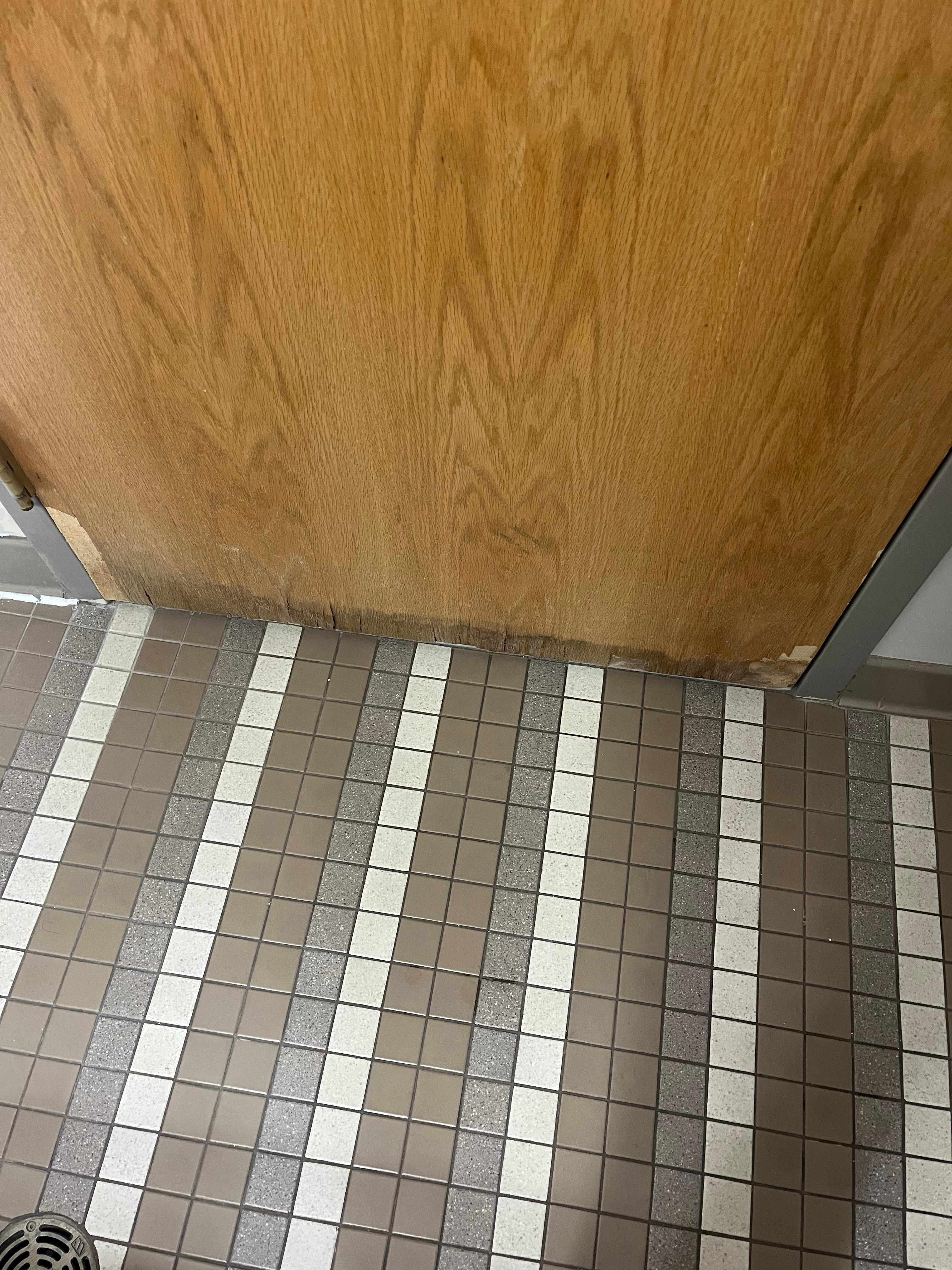 Bottom of the door coming apart, I would assume from water and moisture