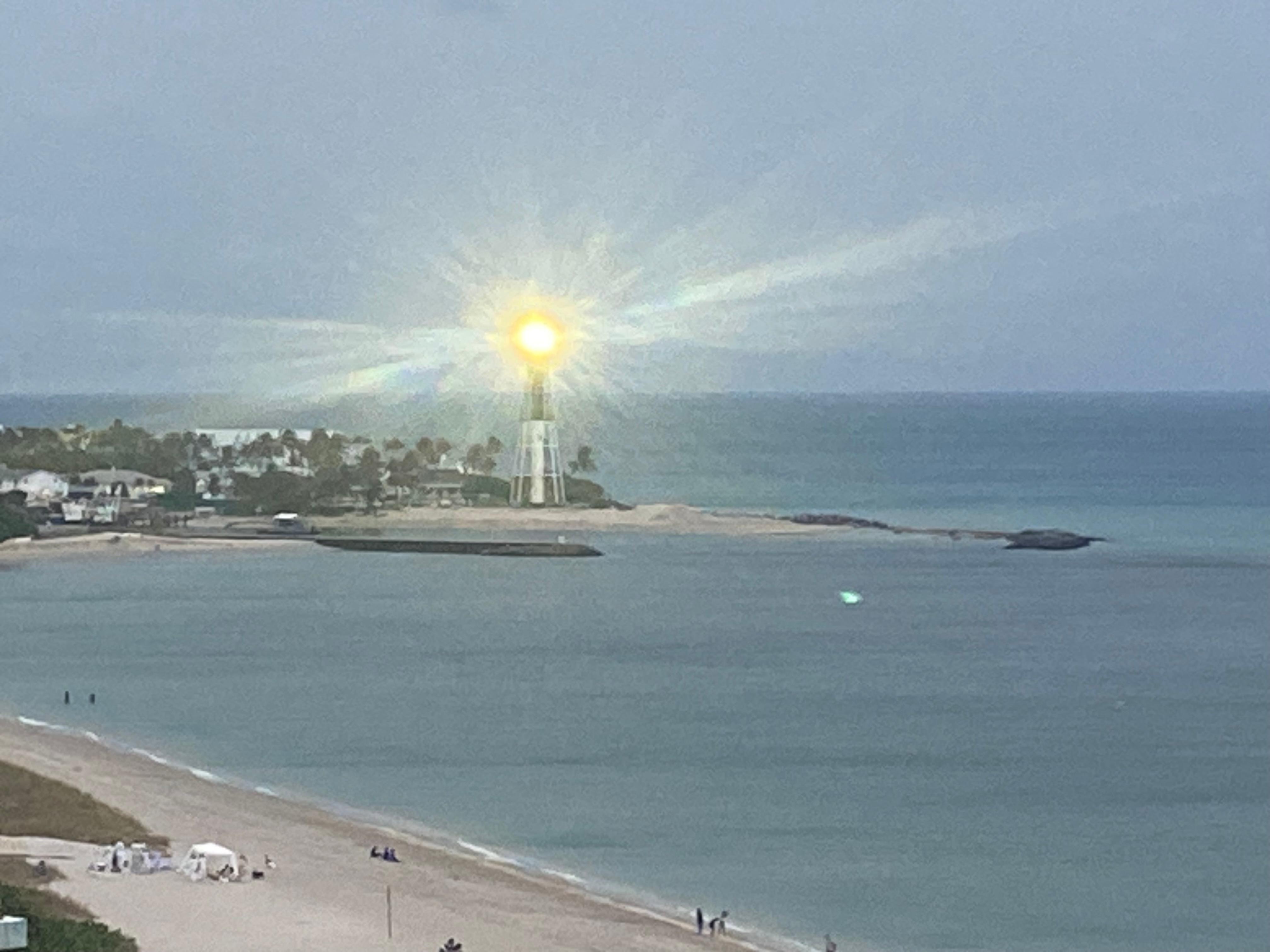 View of ocean and lighthouse from room. 