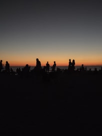 Silhouettes against the sunset, while listening to the Drums on Nokomis Beach, an easy 5 minute walk south, on the beach, from Escape Resort & Marina.