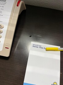 Dead flies on the nightstand by the bed.