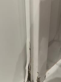 bathroom door frame needs repair - moldy smell
