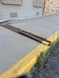 The serious tripping risk on the sidewalk outside the hotel!