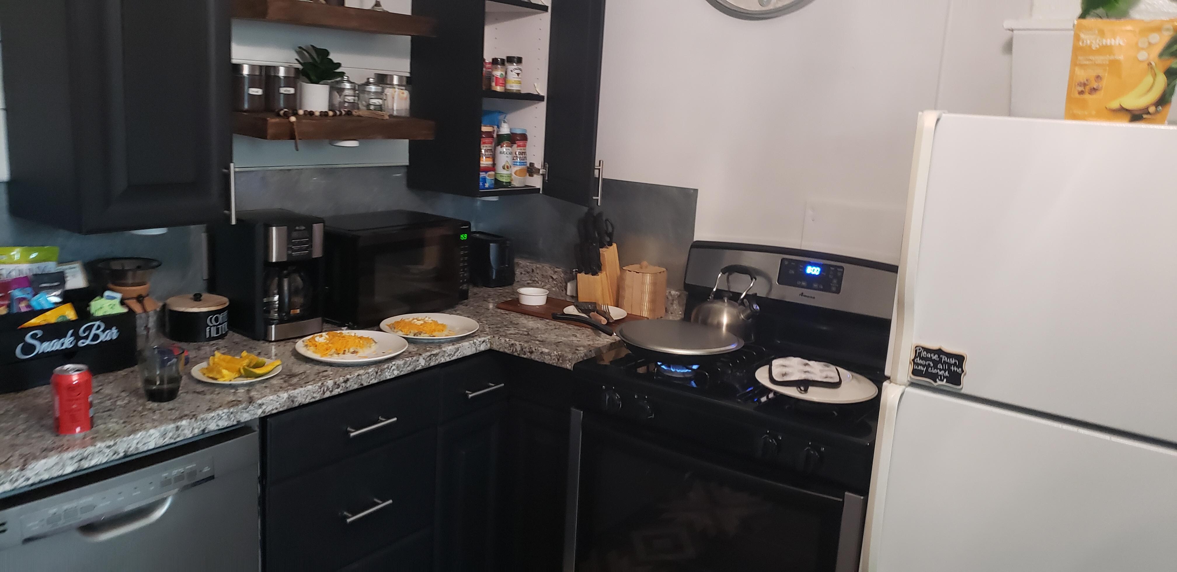 Ample kitchen, equipped, and has basic spices, oil, etc.