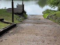 Nice ramp to get canoe or kayak to the lake but blocked by chain. Owners couldn't get a key from the HOA. HOA toke home owner there was not a chain across the ramp. See chain in picture