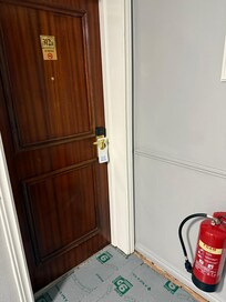 You can see our room here with no carpet just staples on the edges of the hallway