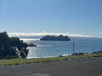 View from the verandah as a cruise ship leaves in the evening.