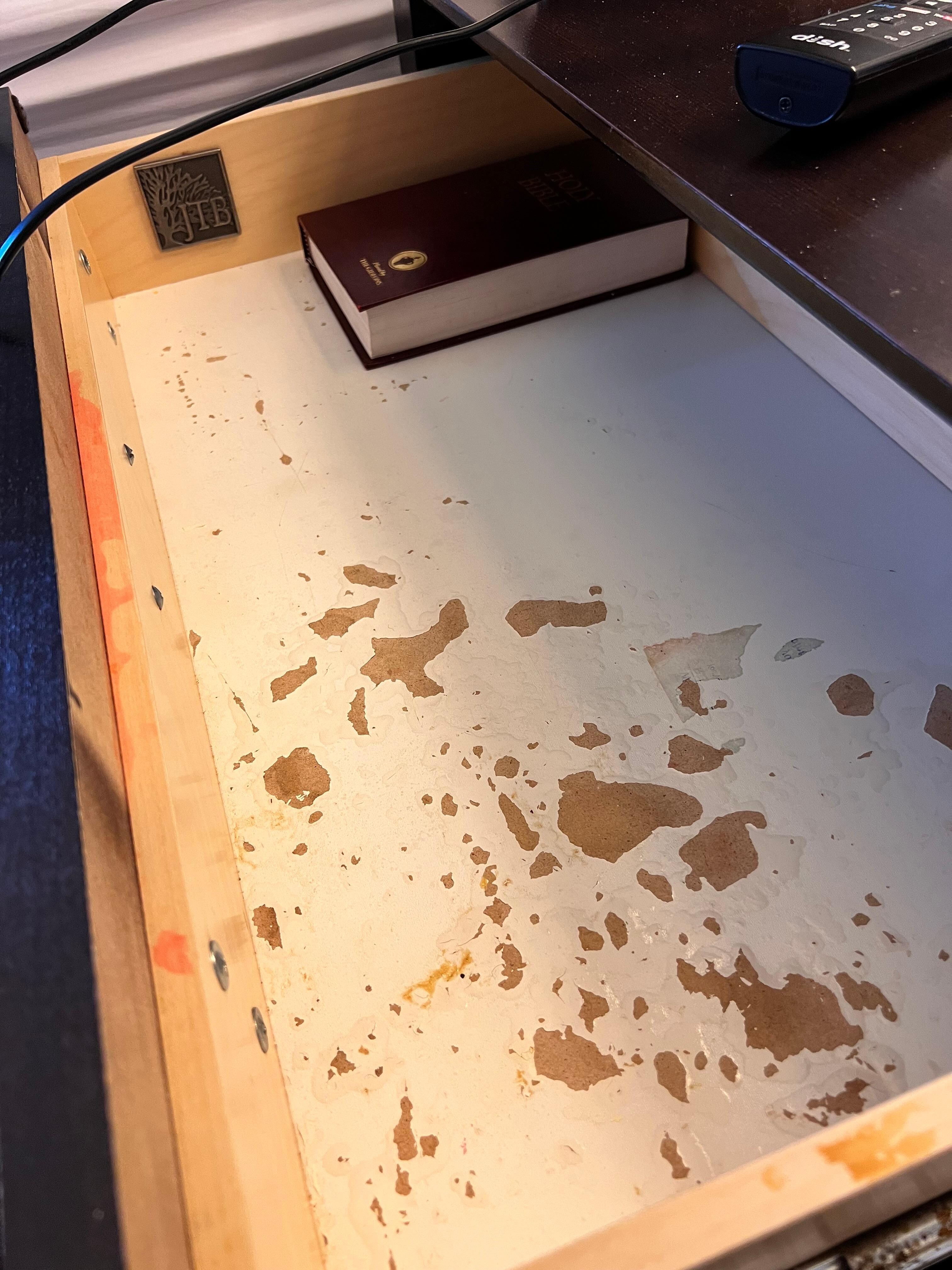 Inside drawer of night stand - no damage under magic book