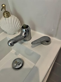 Bathroom basin tap top not attached