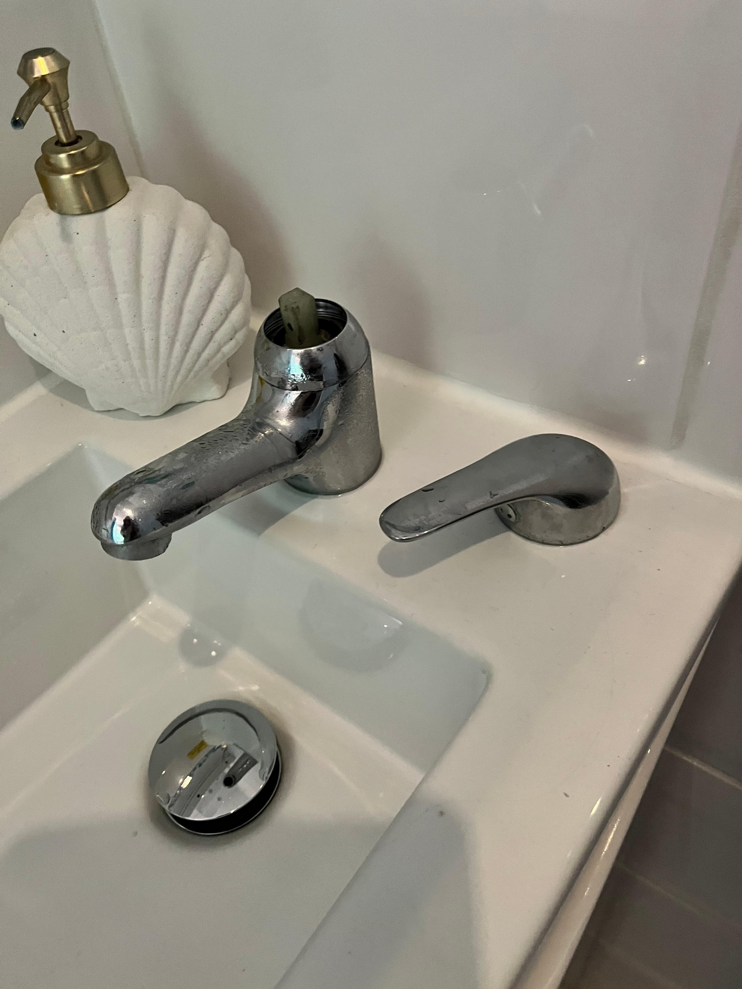 Bathroom basin tap top not attached