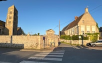 Gite is the front part (brown roof) of the house across the street from church