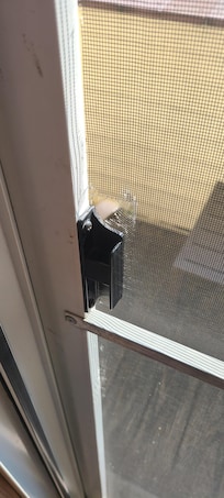 Hole in screen door.