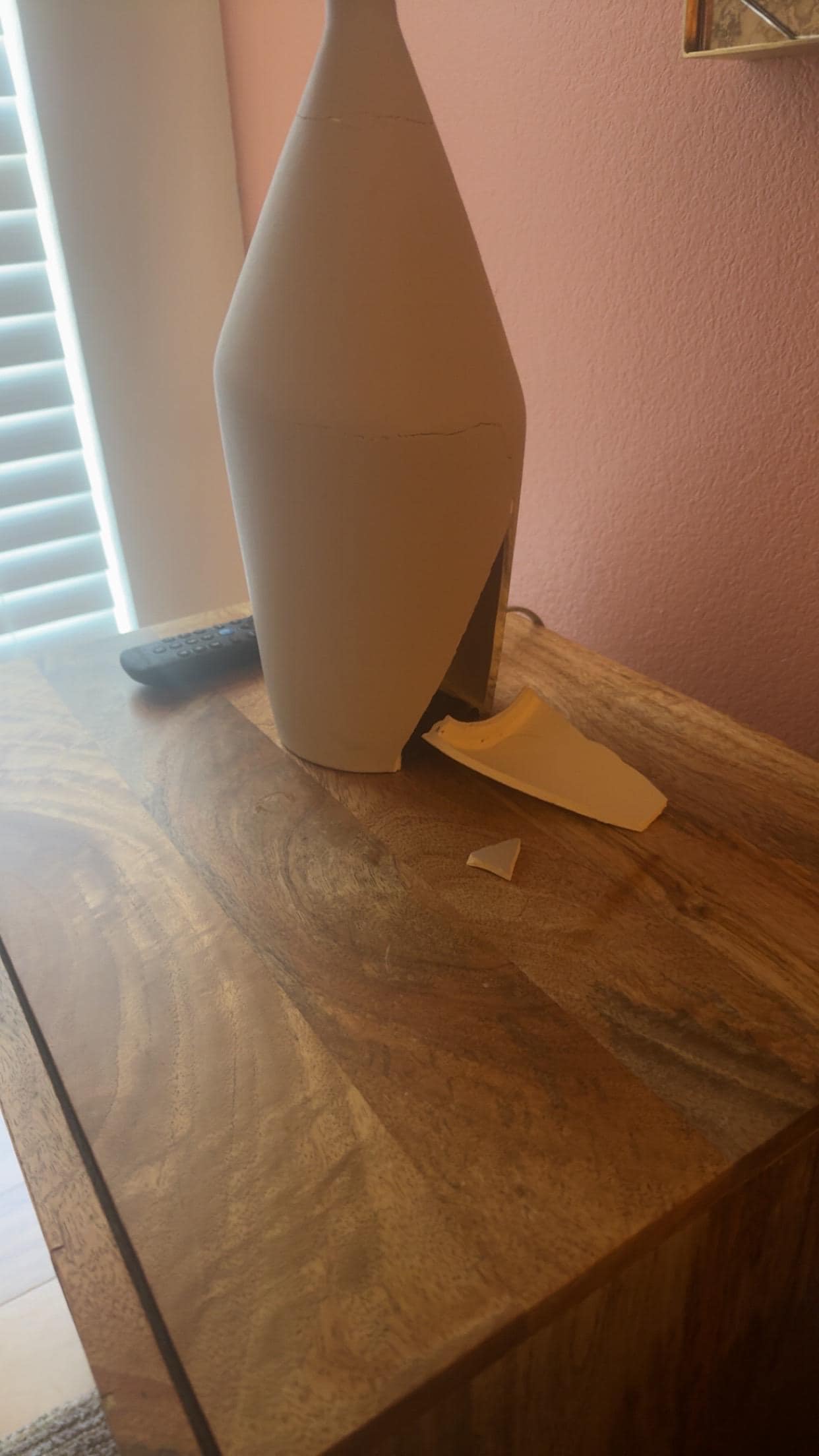 Master bedroom, broken lamp looks like it had been super glued together. 