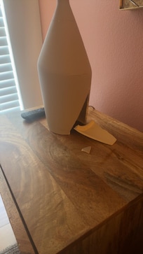 Master bedroom, broken lamp looks like it had been super glued together.