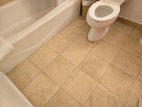 Cracks in the floor and shower tiles.  Is the floor sinking?