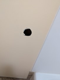 Hole in wall looks like it has been there a while