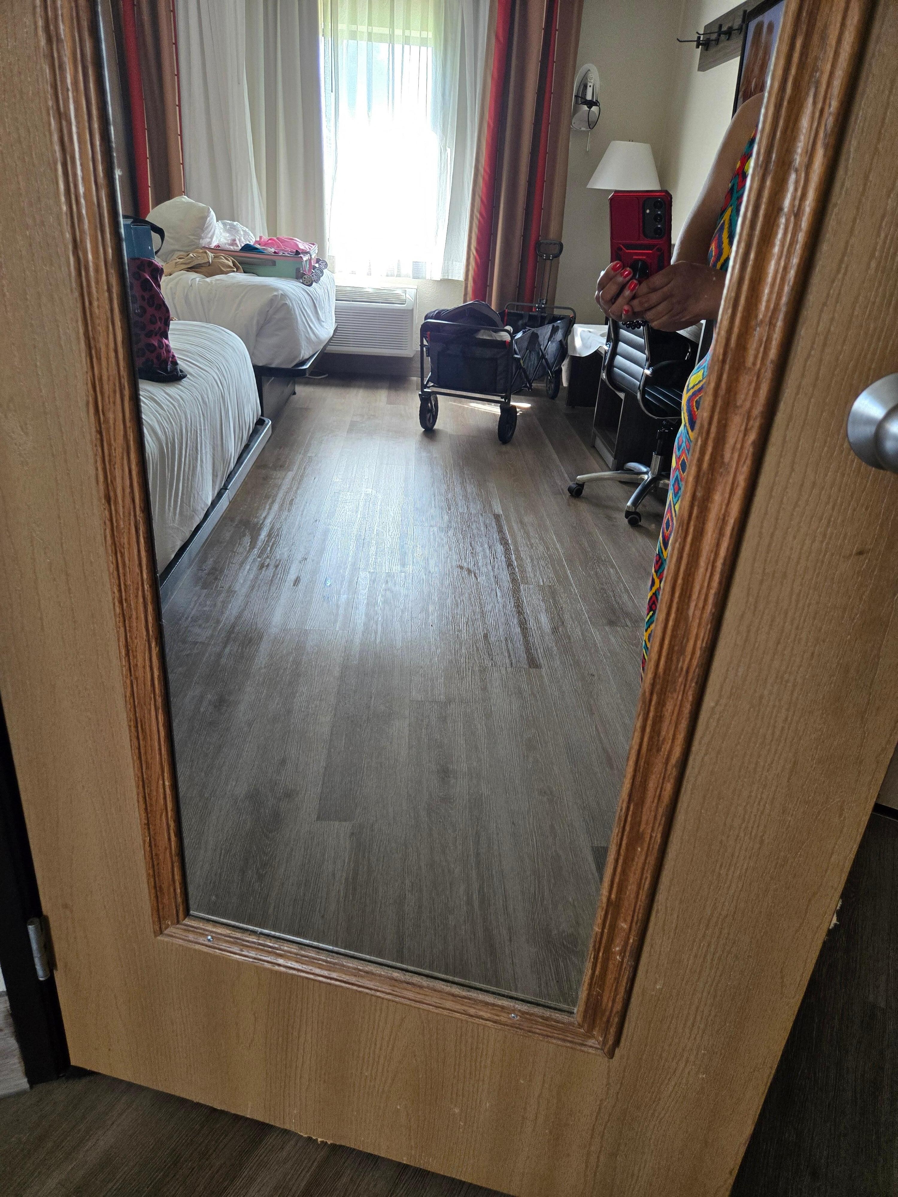 This mirror photo shows how greasy the floors were from products they used. Floors very slippery.