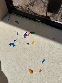 Broken balloon pieces around the deck and in the pool.