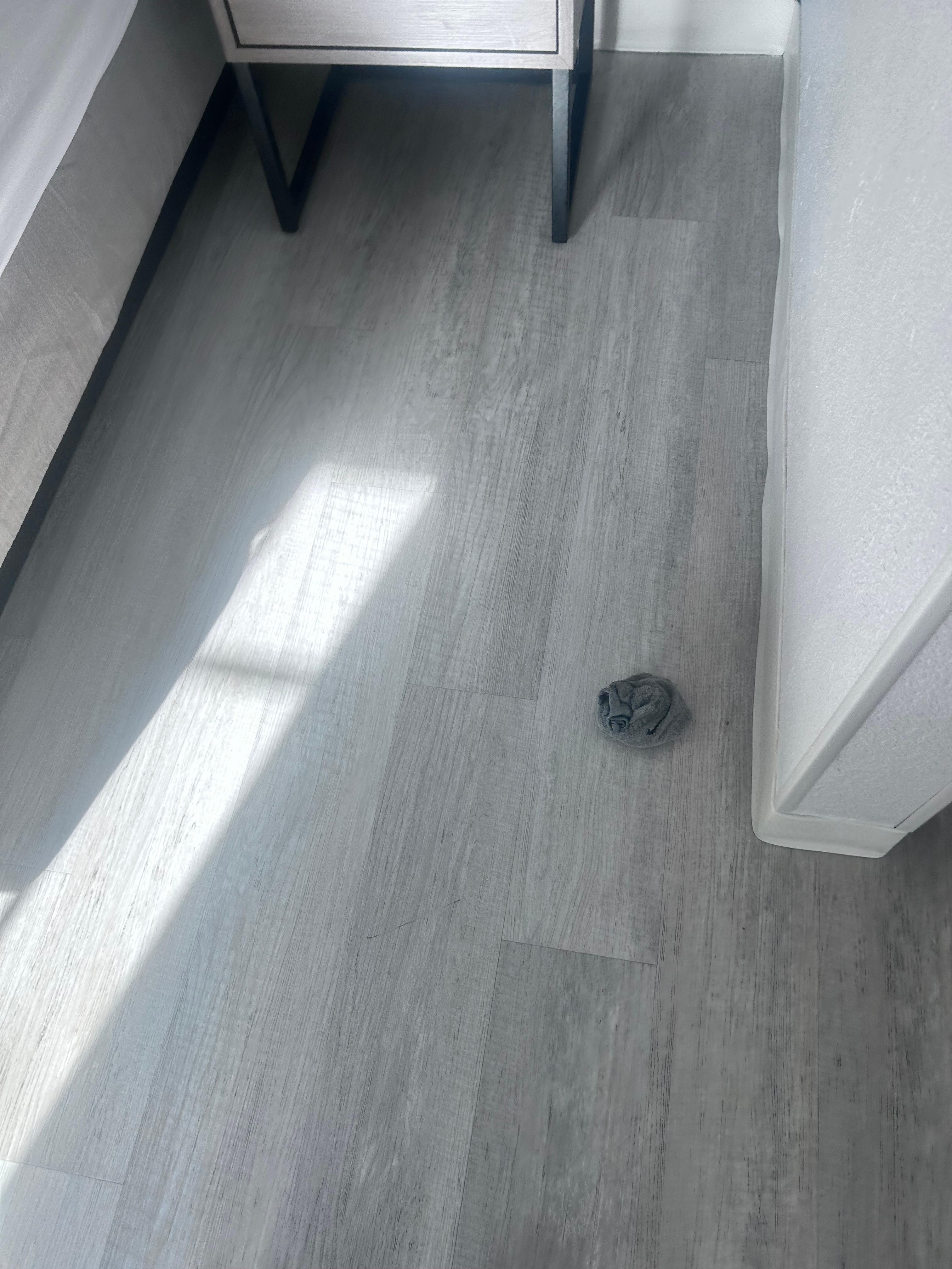Socks left on the floor with dirt and dirty fork