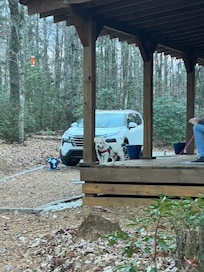 Nice seating on front porch - Mattie checks it out