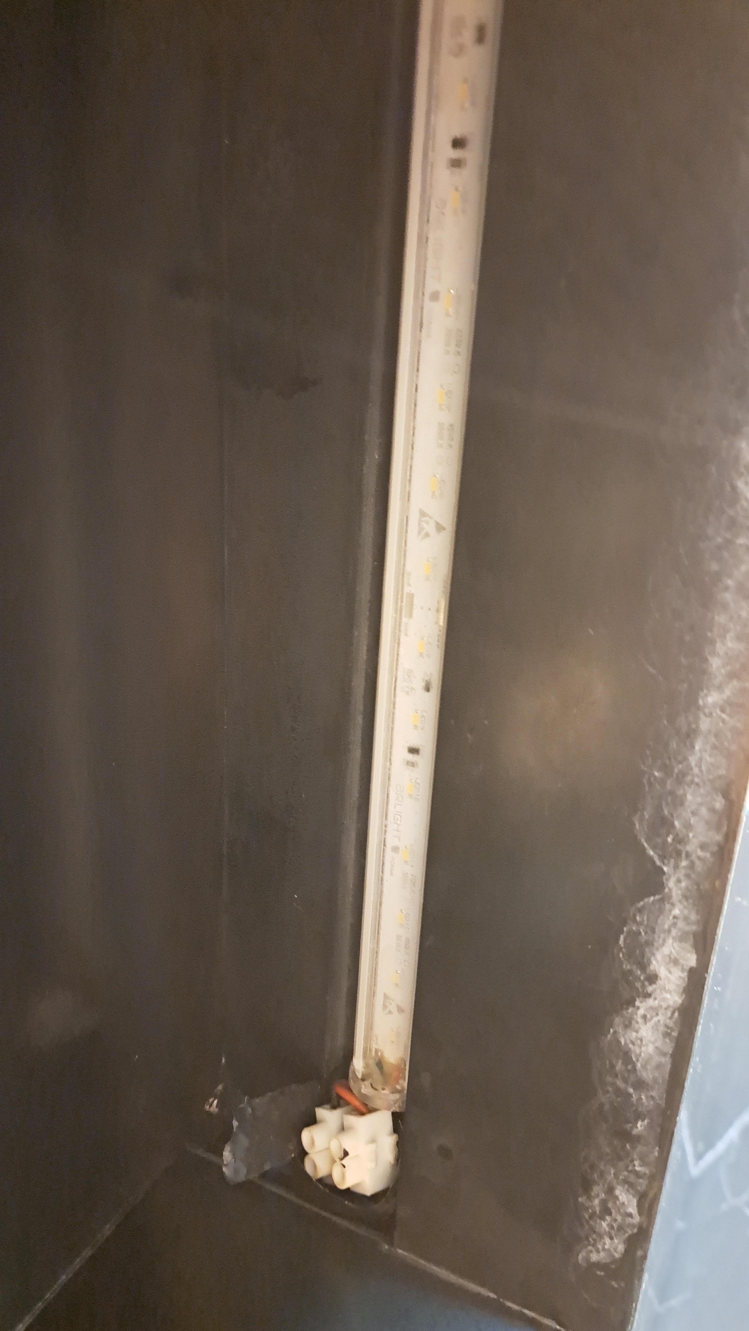 Exposed wire in the shower.