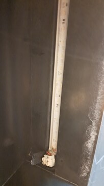 Exposed wire in the shower.