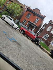 Neighbors' cars in front of home