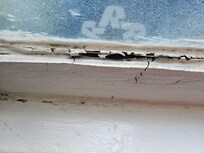 One of the kitchen windows - center shows the hole to the outside