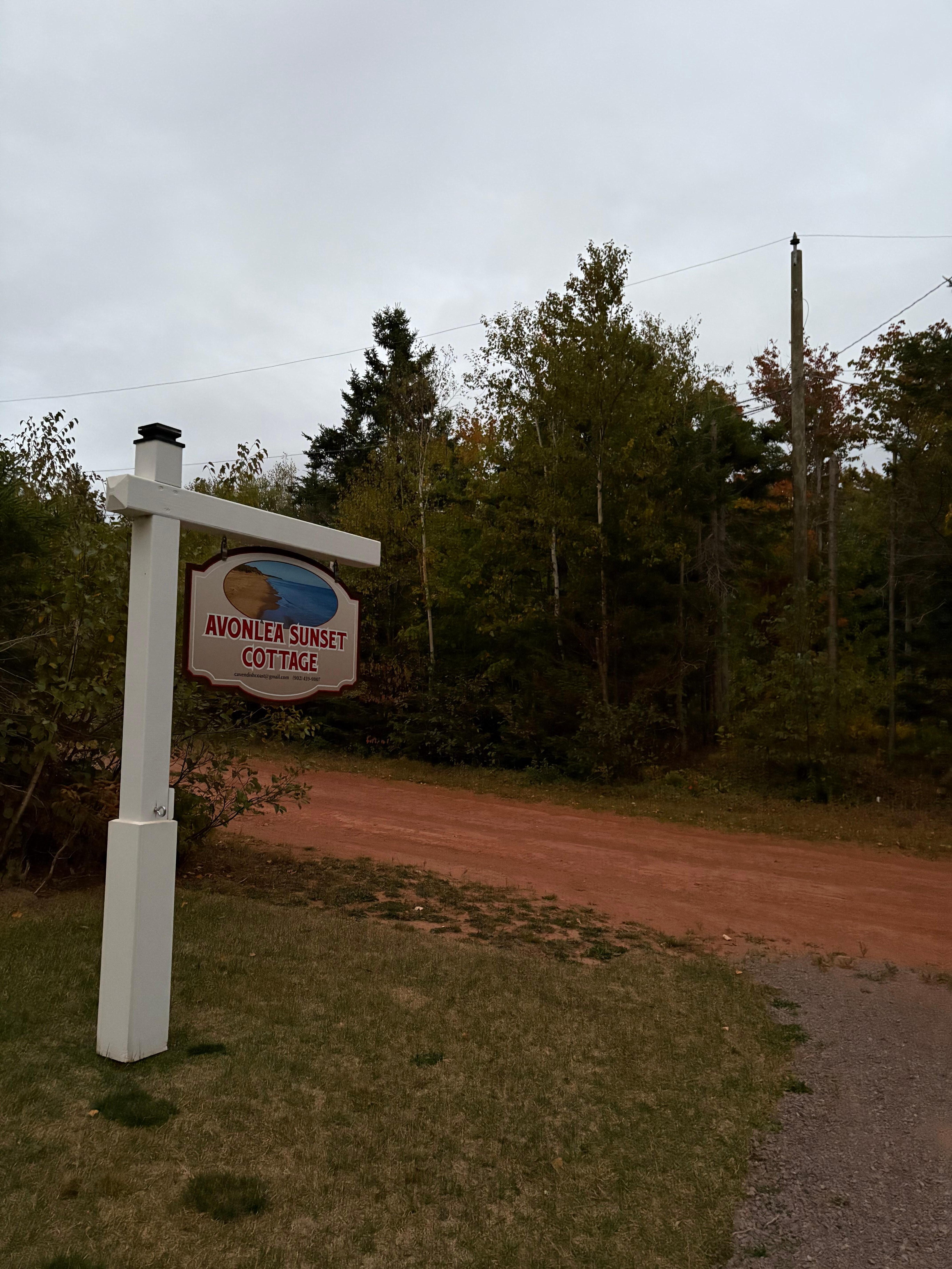 Welcoming Sign and the red dirt road!