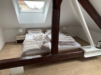Have to step over a beam to get to bed