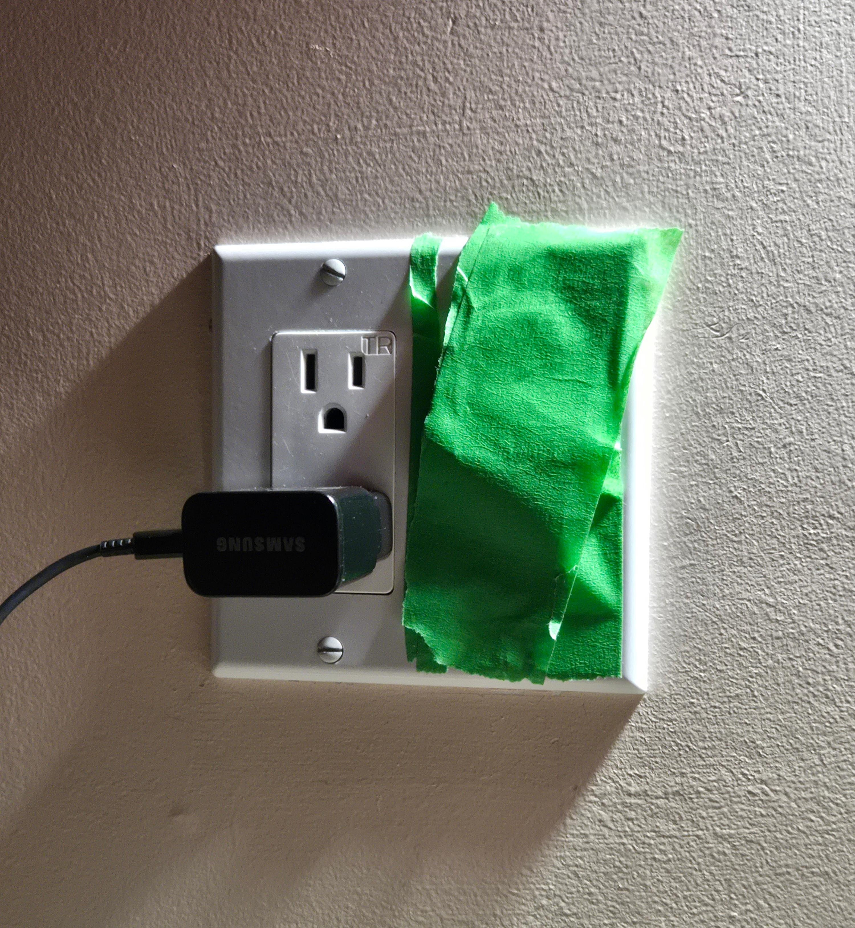 Painters tape over broken light switch for the bedside wall lights. 
