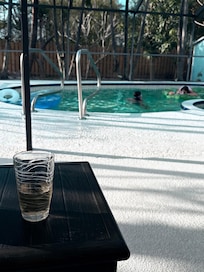 Enjoying the Florida weather while the kids swim