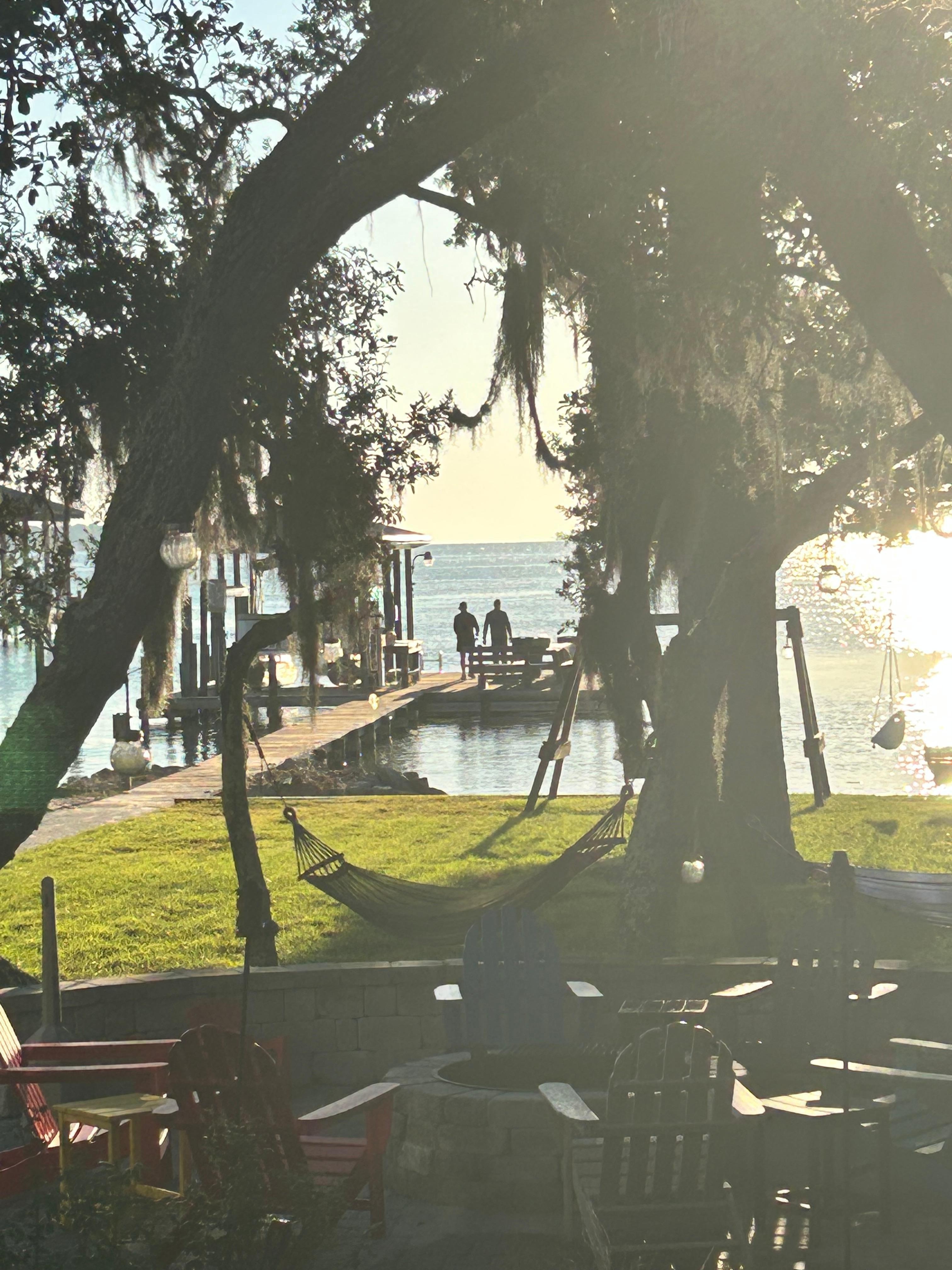 Father and son fishing in the morning on the dock.  