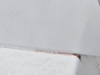 This one is up front near the outside edge of the tub.