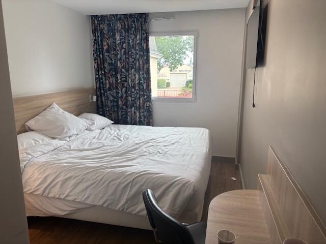 Nice enough bed, but the room is so small, you can barely walk around the bed.  The shower was nice. The aircon worked at least and they had elevators. 
