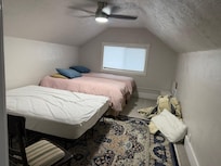 Upstairs bedroom with full and two queens has different layout than pictured in description. Has Pack&Play and some toys in closet.