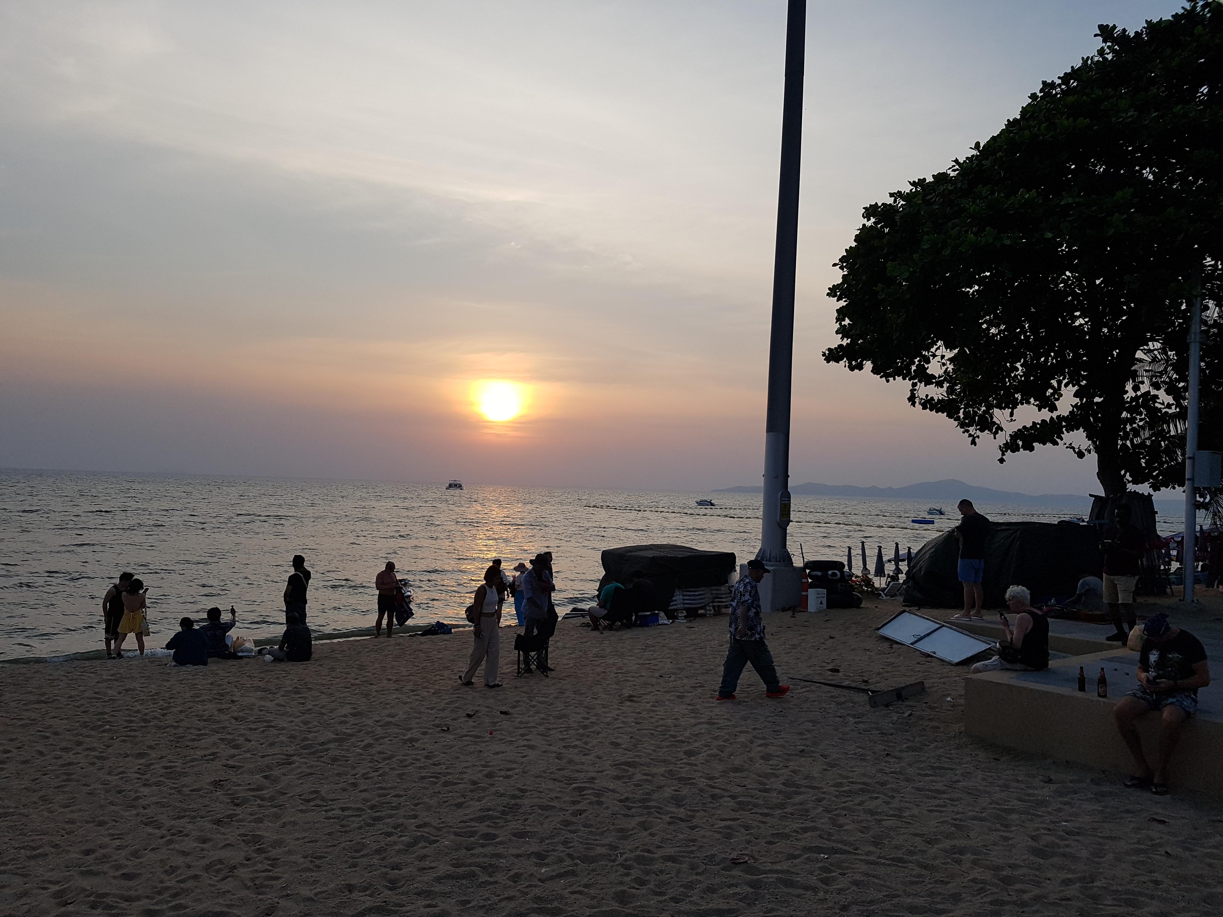 Beach pavement opposite Hotel Opal House at sunset.