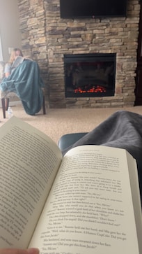 Reading by the fireplace with my daughterâŠ..