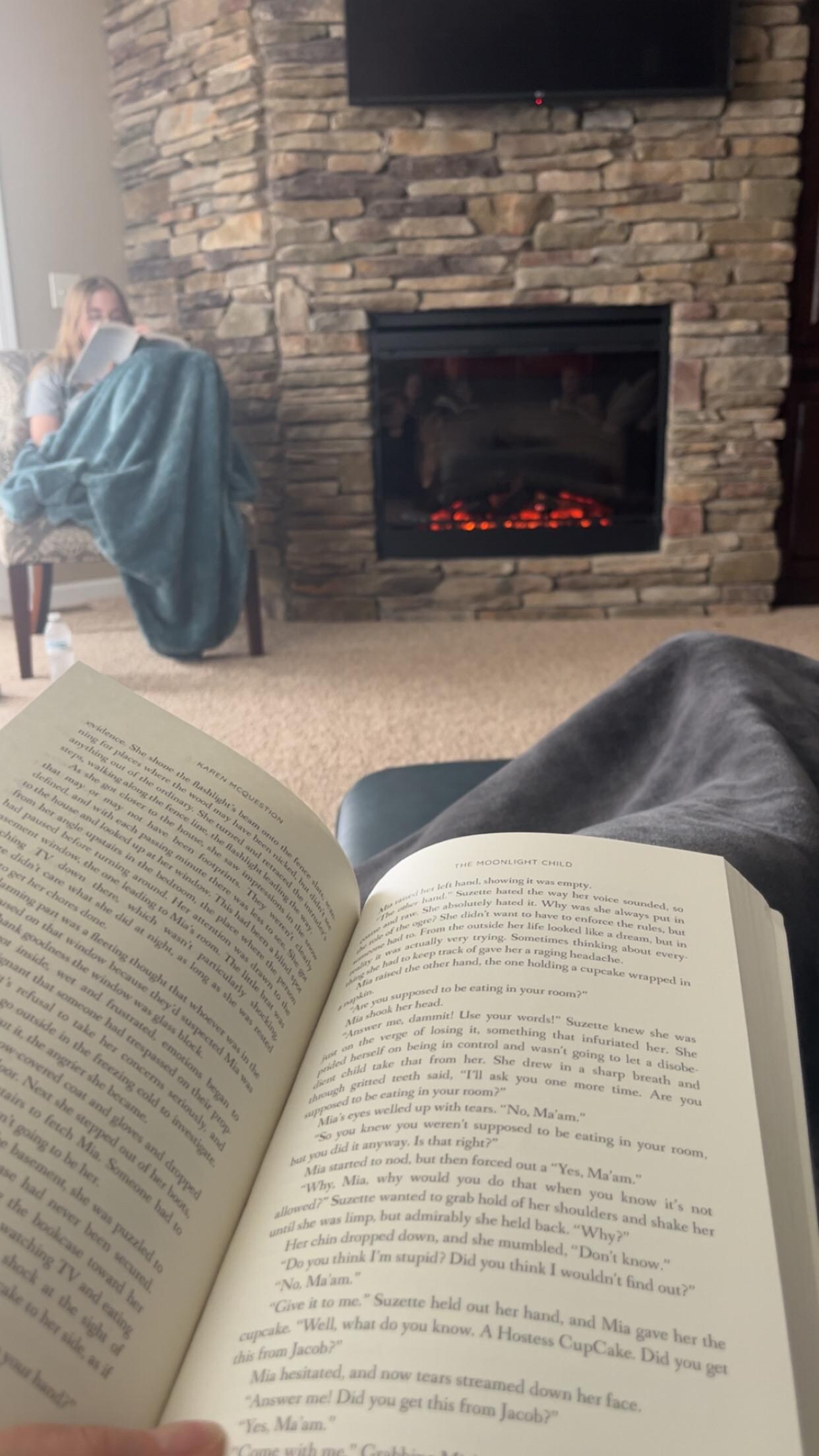 Reading by the fireplace with my daughter…..
