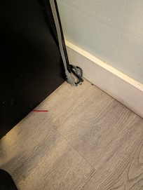 Trash by mini fridge