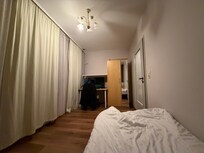 Dimly-lit room.Curtains do not cover all the windows!