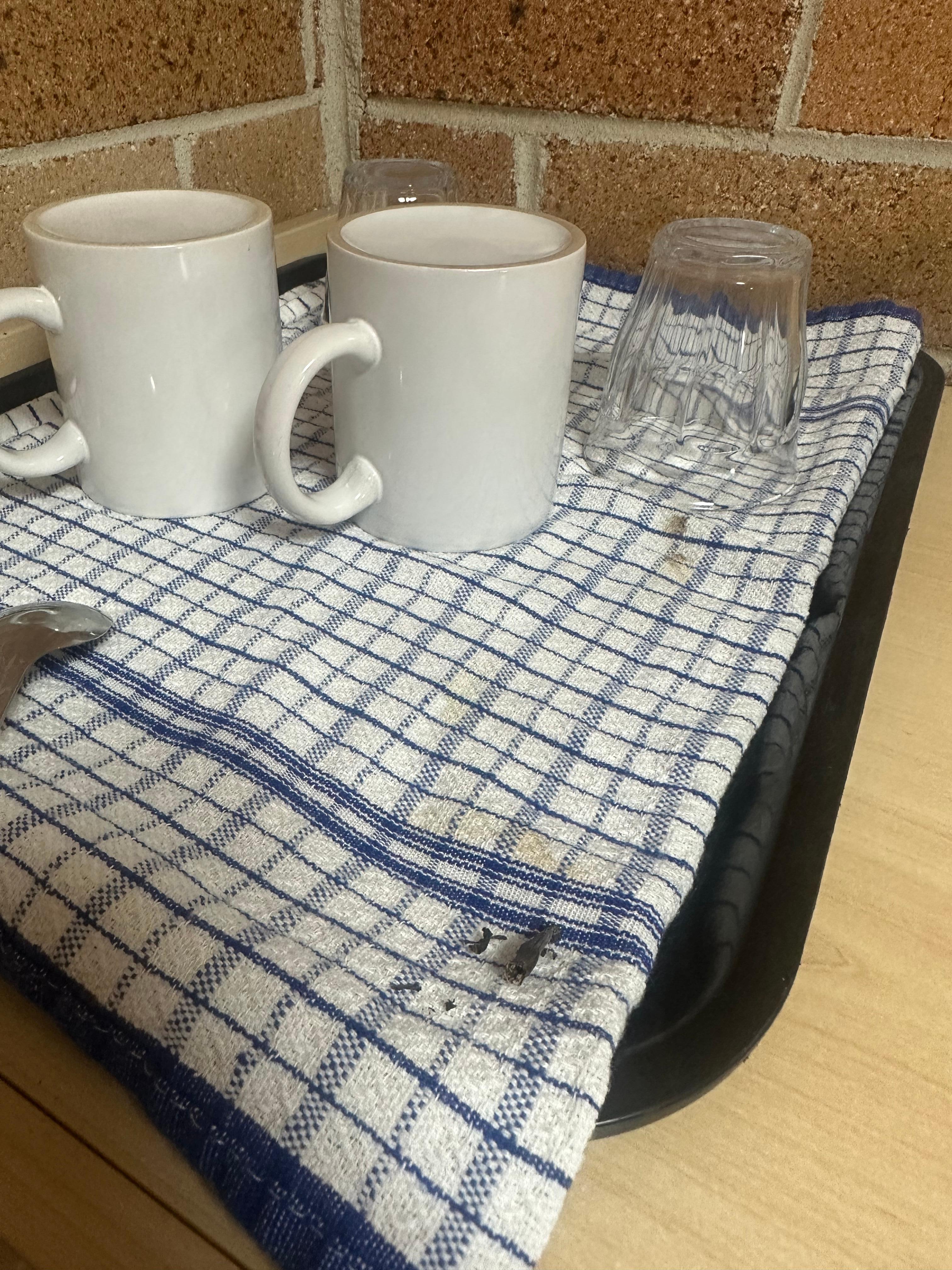 Dirty Tea Towel which the cups sit on